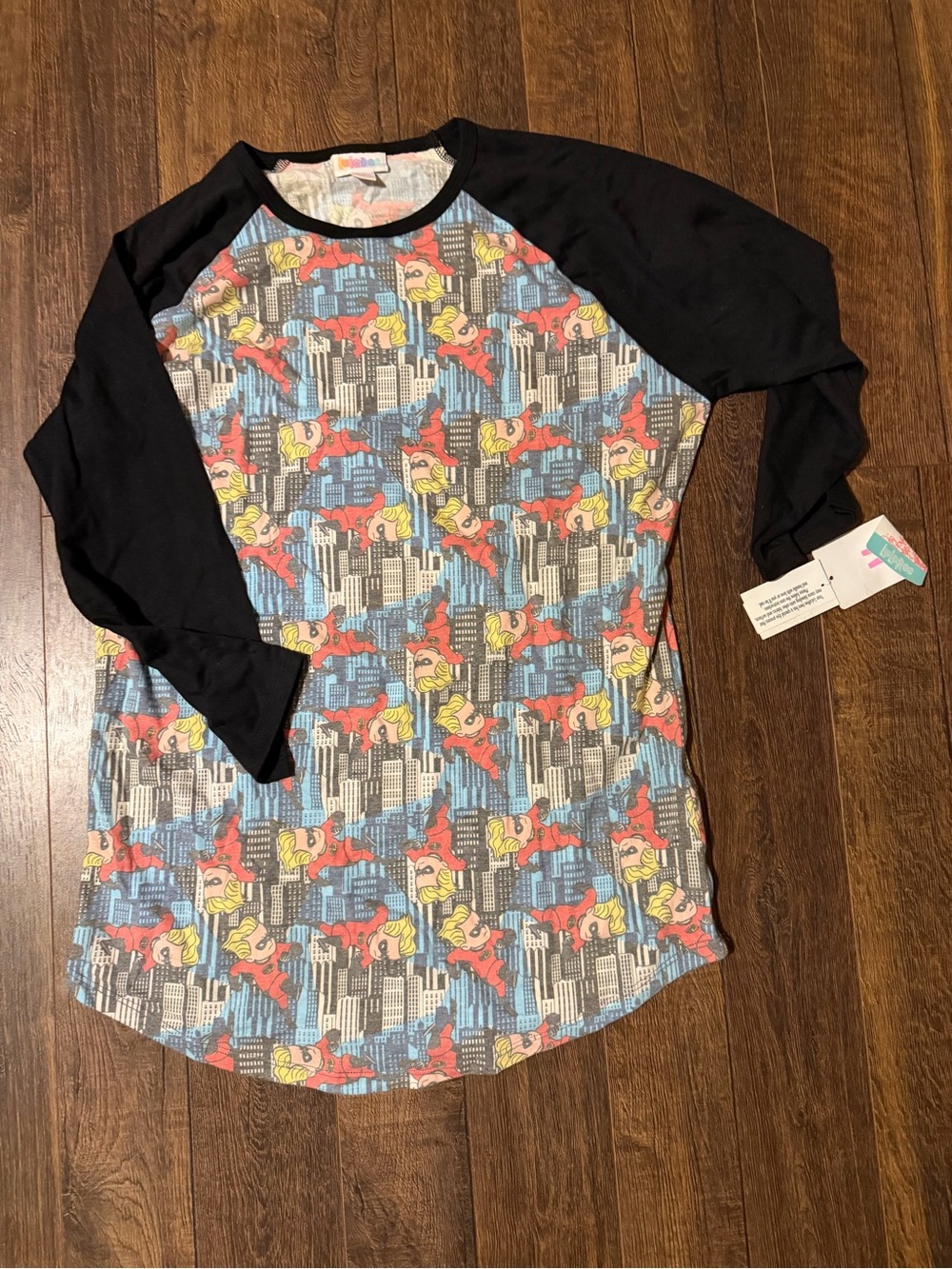 LuLaRoe Black-Sleeve Raglan w/ Dash from Incredibles , Yellow & Blue City Print